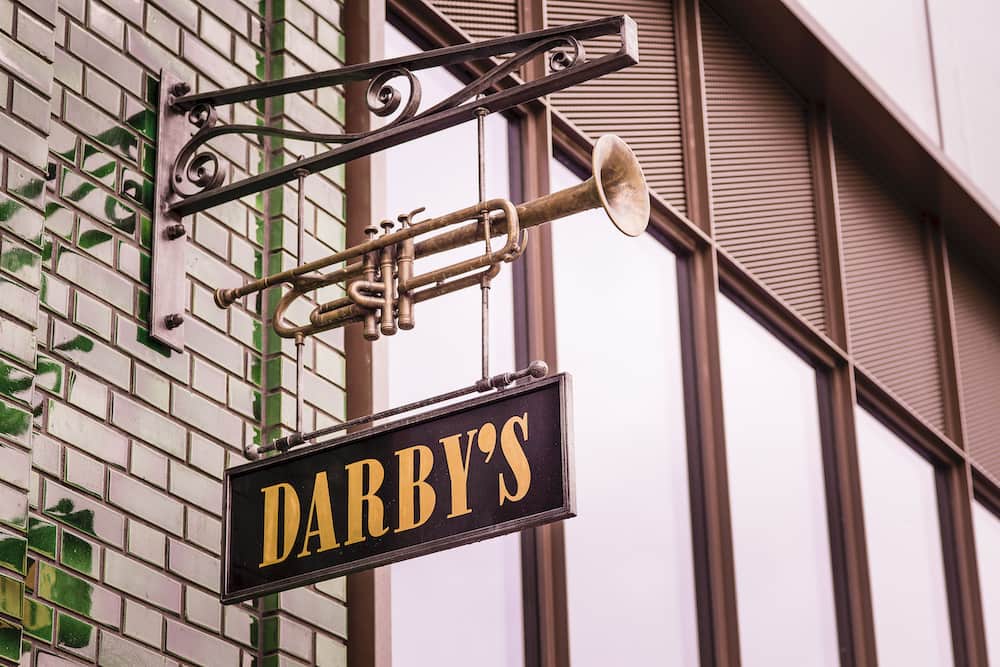 Darbys London restaurant exterior signage with architectural LED lighting design